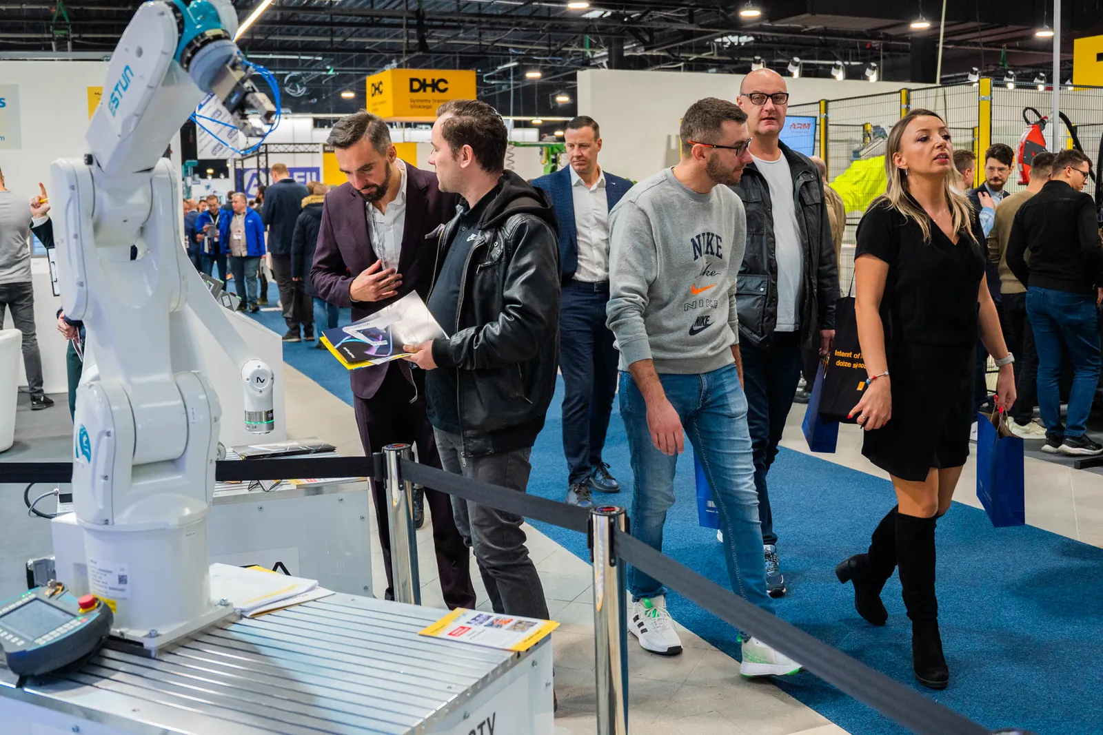 Visitors at robotics stands, Warsaw Industry Week 2025