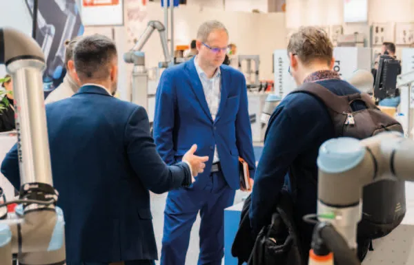 Engineers discussing a robotic application